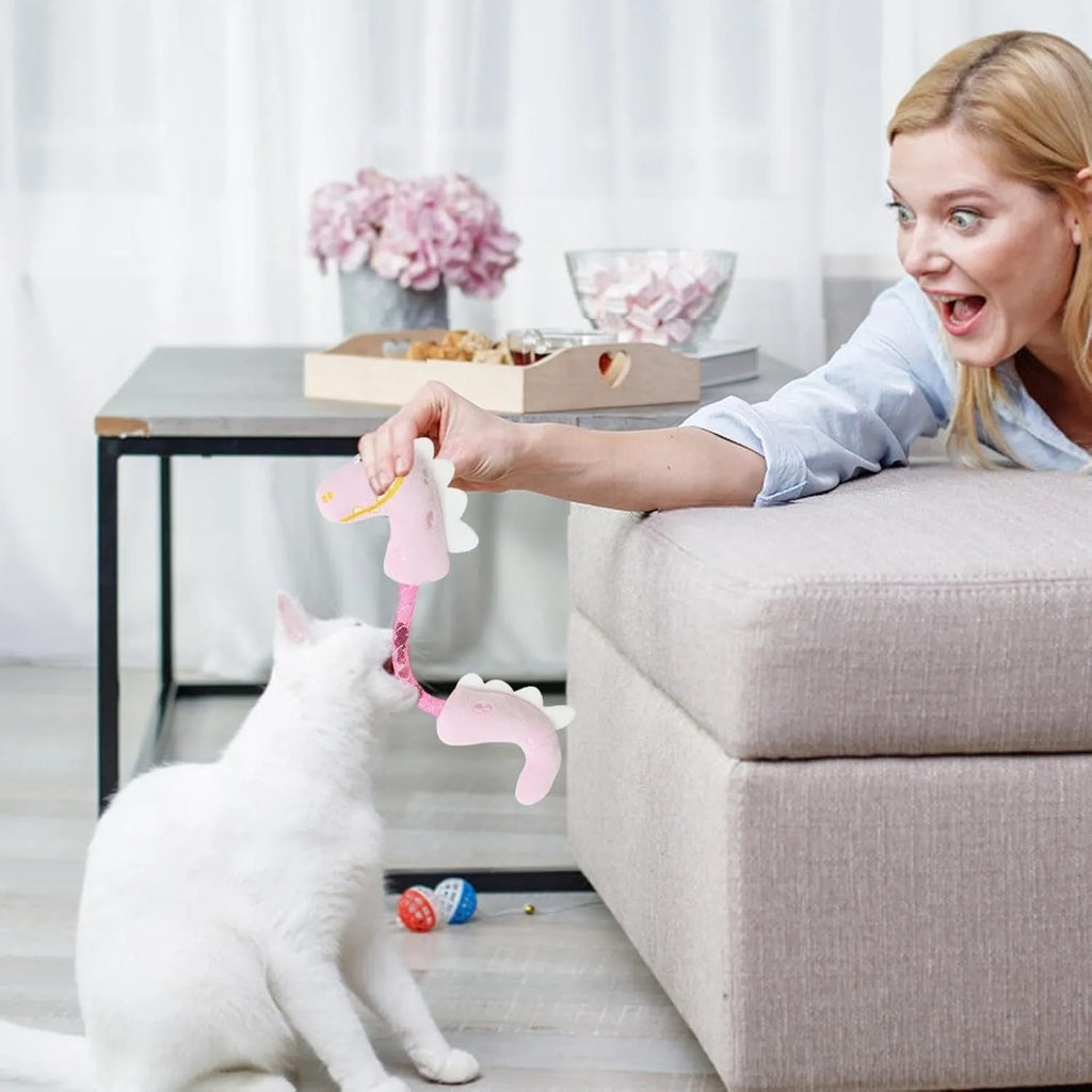 Four plush cat toys including catnip chew toy, squeaky mouse, textured fish, and bunny for indoor play