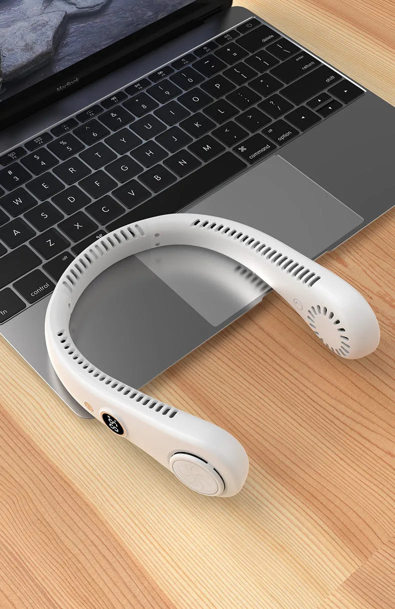 Pink USB rechargeable bladeless neck fan hanging with flexible neckband.