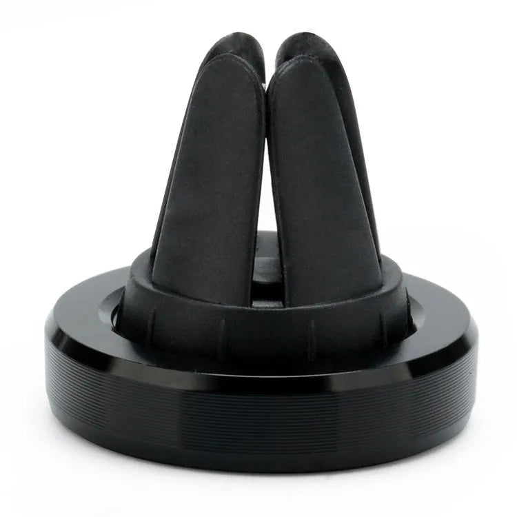 A compact metal magnetic phone holder clipped to a car air vent.