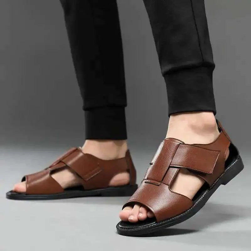Men's black and brown Roman-style leather sandals with an open toe and non-slip rubber sole.