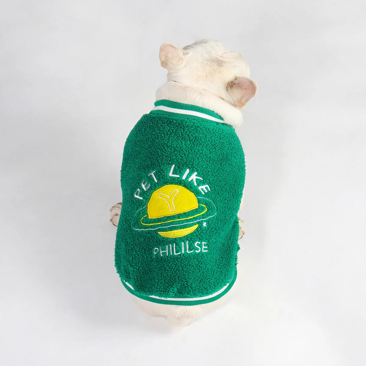 Green fleece-lined cotton winter coat for a large dog on a white background.