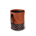 Retractable leather car trash can with waterproof lining and carry handle shown in vehicle