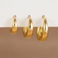 Three glossy geometric copper earrings set in gold electroplated finish