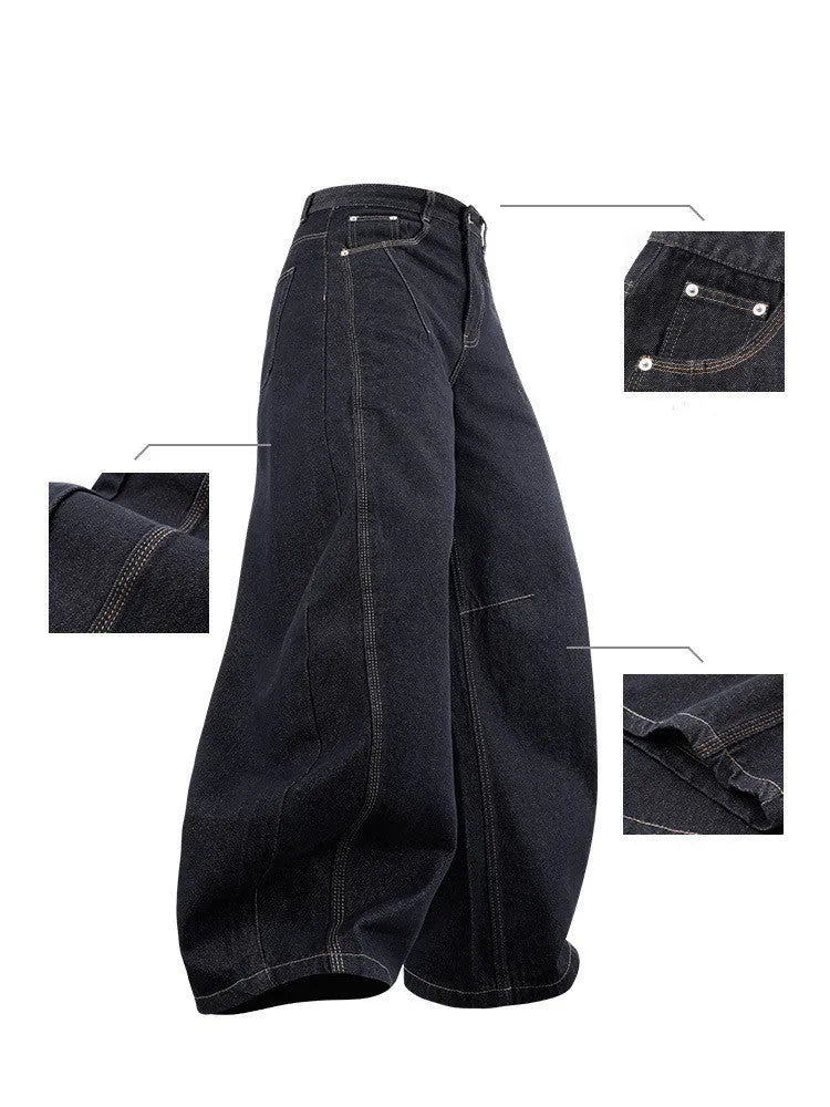 Men's wide leg denim trousers in original cow colour on a hanger, showing the relaxed fit and mid waist design.