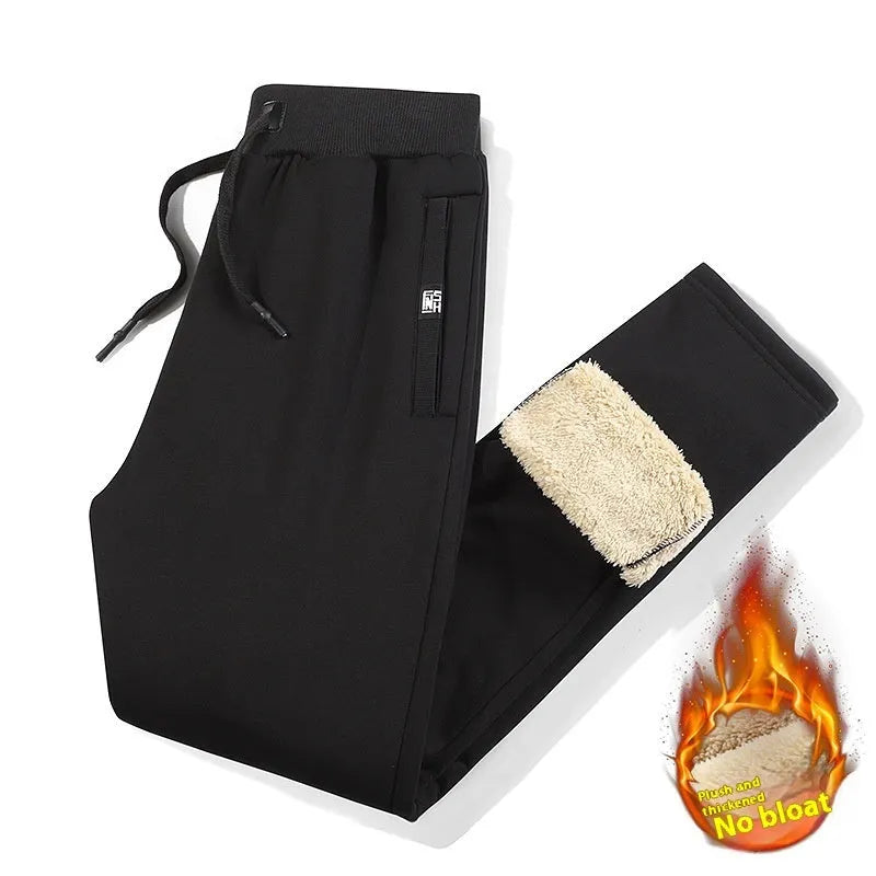 Men's grey fleece-lined oversized track pants with elastic waistband and straight leg cut