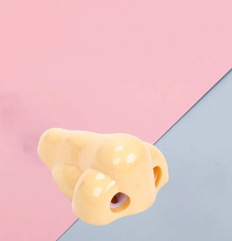 Flesh colour plastic pencil sharpener with large nostril opening for students