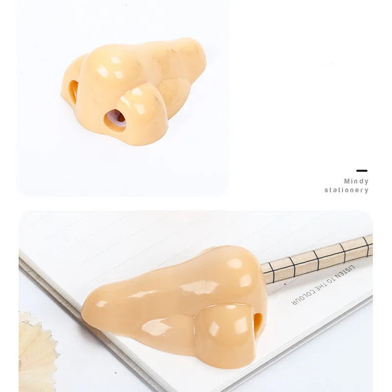 Flesh colour plastic pencil sharpener with large nostril opening for students