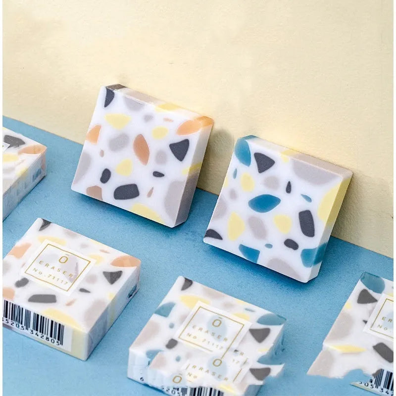 White brick-shaped rubber eraser for traceless pencil mark removal on paper