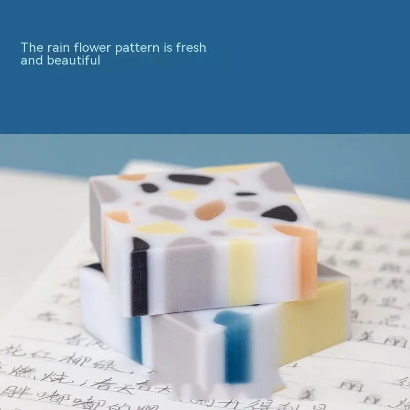 White brick-shaped rubber eraser for traceless pencil mark removal on paper