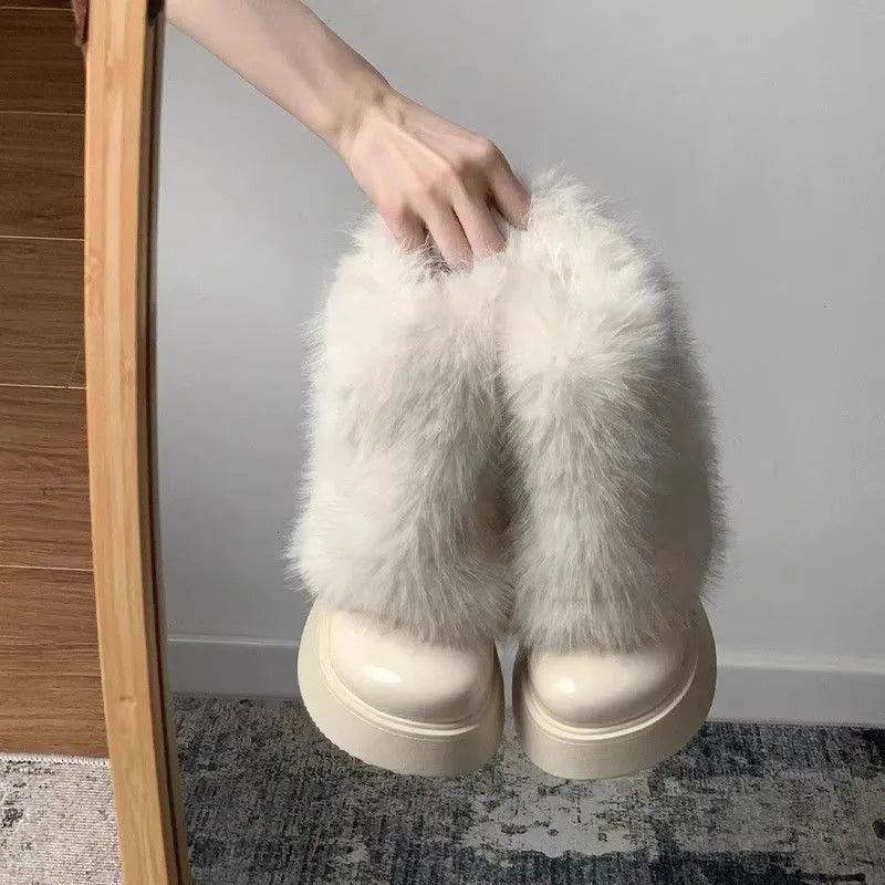 Women's black fleece-lined snow boots with a waterproof rubber platform sole on a white background.