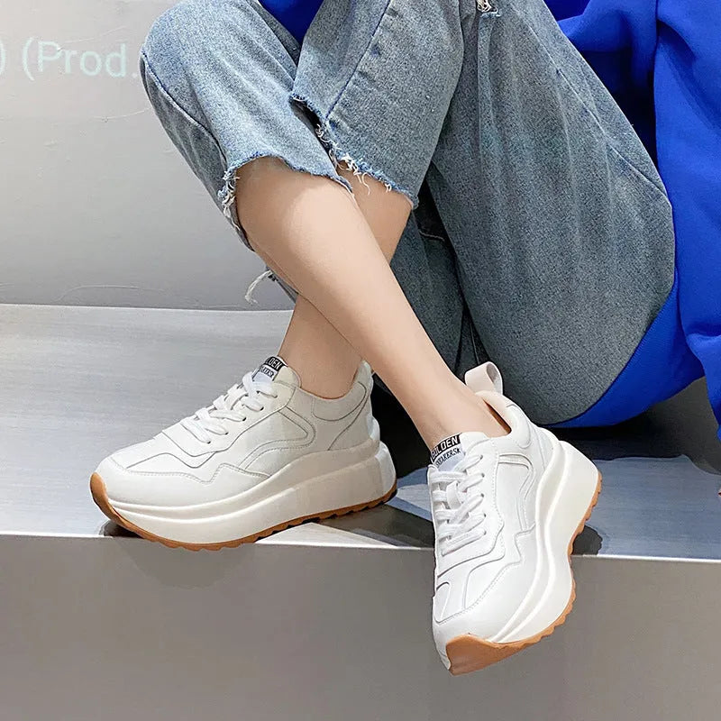 Beige women's low-top leather sports shoes with cross strap and English muffin heel