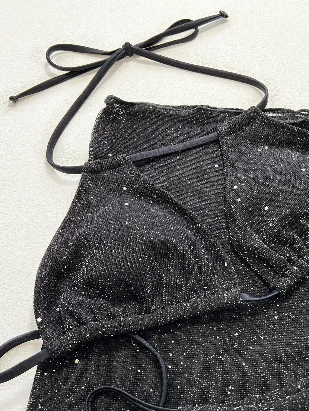 Black polyester three-piece bikini swimsuit set with separate top and shorts