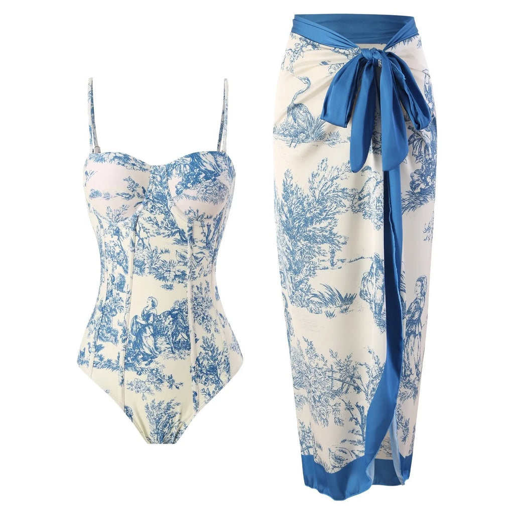 Blue women's one-piece swimsuit with a matching separate gauze skirt laid flat.