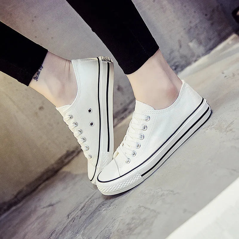 Women's solid colour canvas casual flat shoes showing available colour options and size range