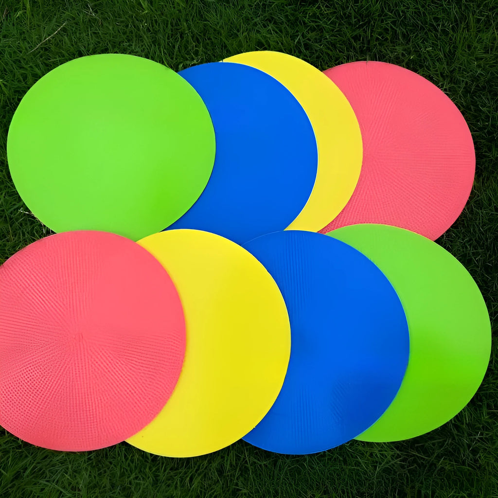 Yellow soft TPE football training target disc lying flat on grass