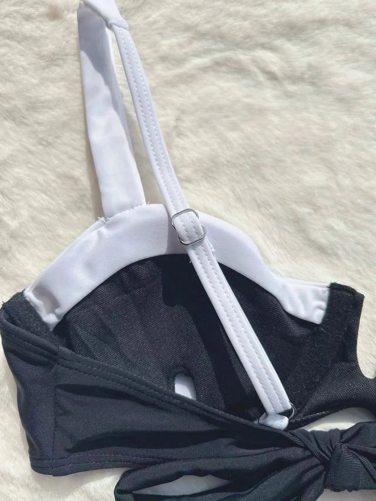 Black low-waist bikini swimsuit for women with split leg stitching, shown as a full set.