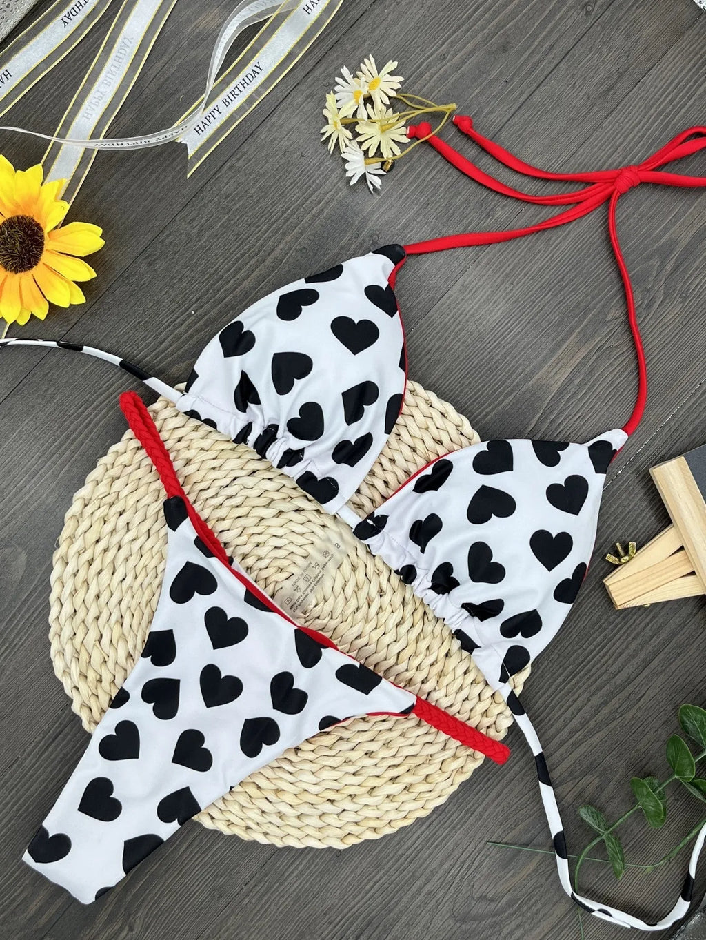 Heart print sexy backless split swimsuit bikini in a briefs style on a mannequin.
