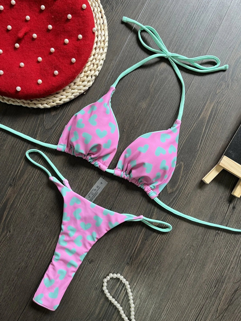 Heart print sexy backless split swimsuit bikini in a briefs style on a mannequin.