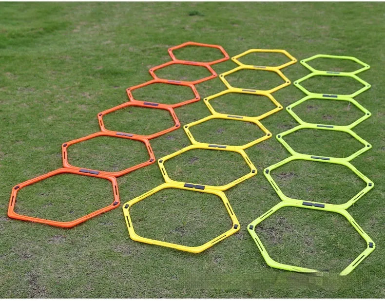 Six foldable hexagonal agility training rings in bright colours for football and basketball drills