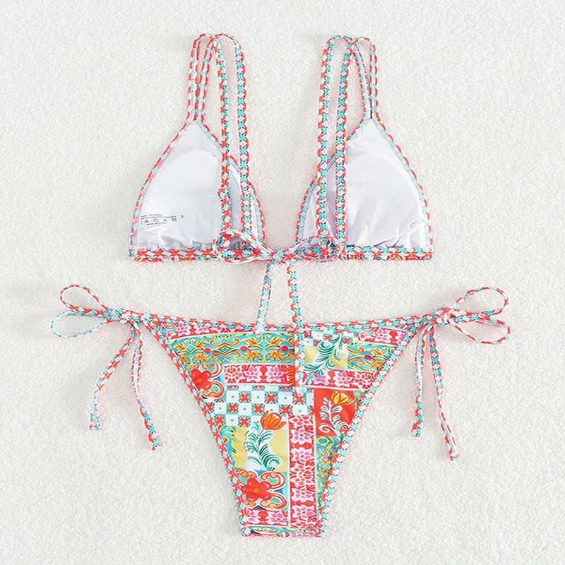 Women's lace-up front split-leg swimsuit in picture colour with brief style bottoms