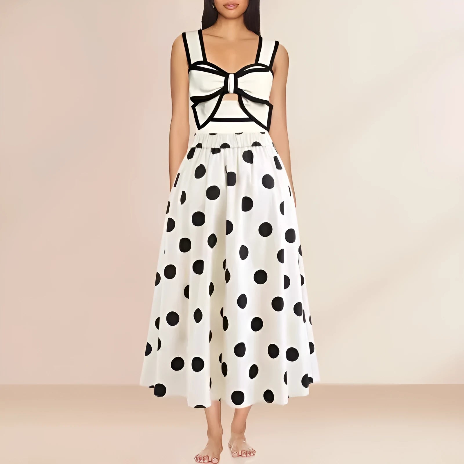 Women's black one-piece swimsuit with attached white skirt-style beach dress and a bow detail.
