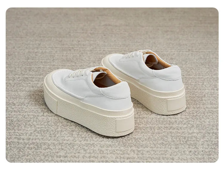 Women's black platform board shoes with embossed cowhide leather upper and round toe design