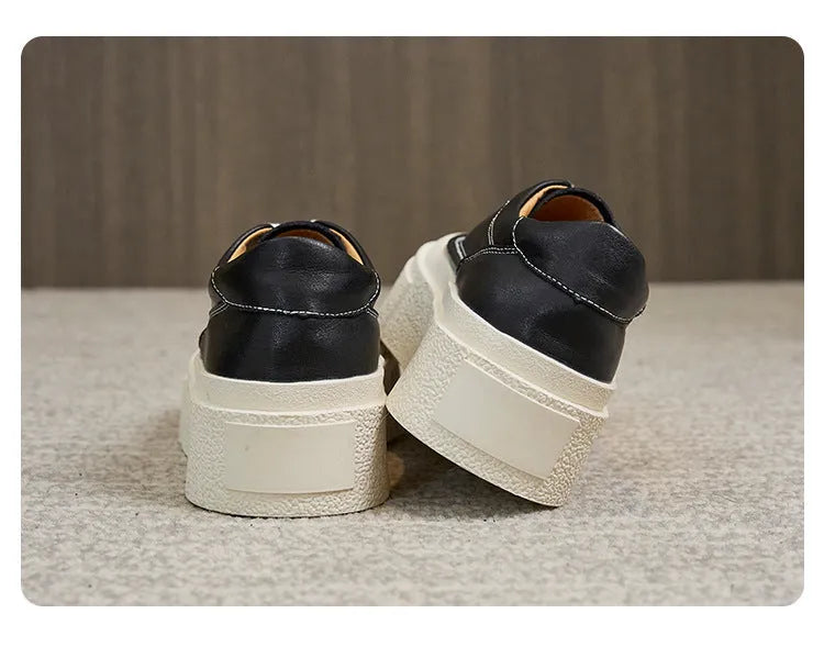 Women's black platform board shoes with embossed cowhide leather upper and round toe design