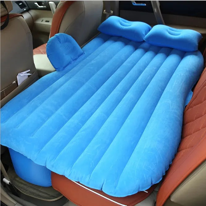 Black inflatable car bed with flocked surface, two pillows, and storage bag for five-seater vehicles