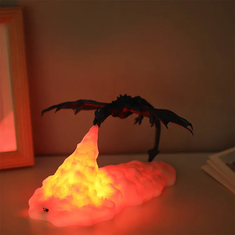 3D printed red dragon night light with USB charging cable on a dark surface