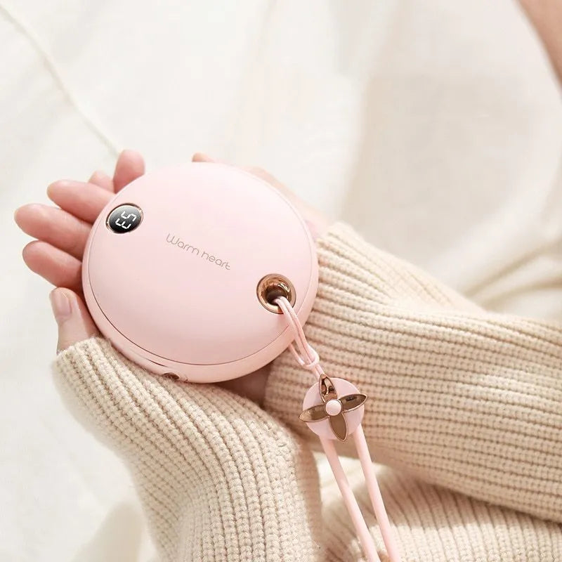 Green hand warmer power bank with digital display showing battery percentage, USB Type-C cable included