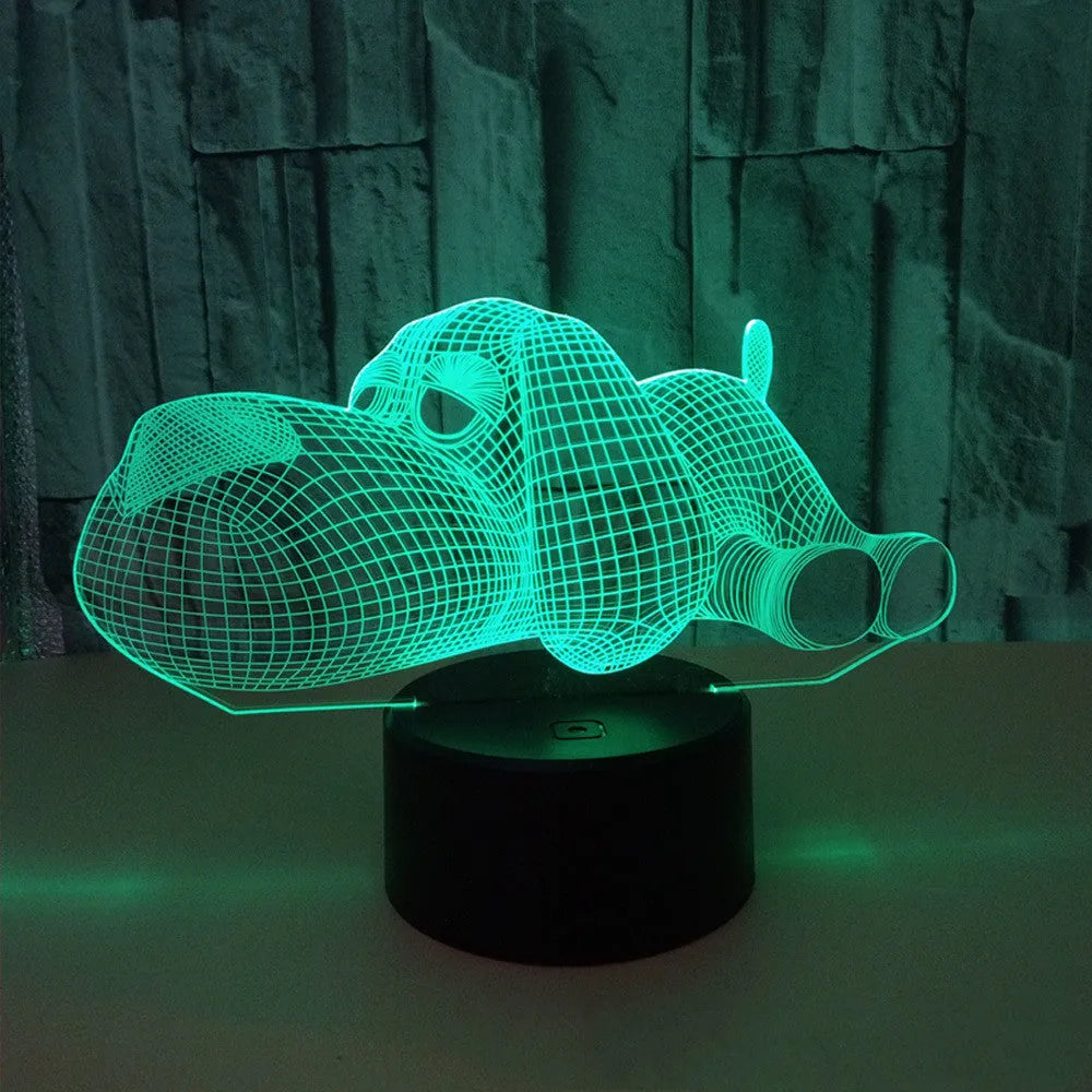 Glowing 3D illusion dog desktop night light showing multiple colour options on a desk.