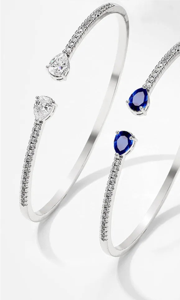Personalised multi-zircon copper bracelet showing white and blue colour options with simple design
