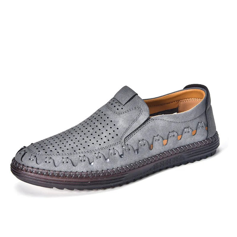 Men's brown slip-on casual leather shoes with round toe and flat PVC sole on a white background.