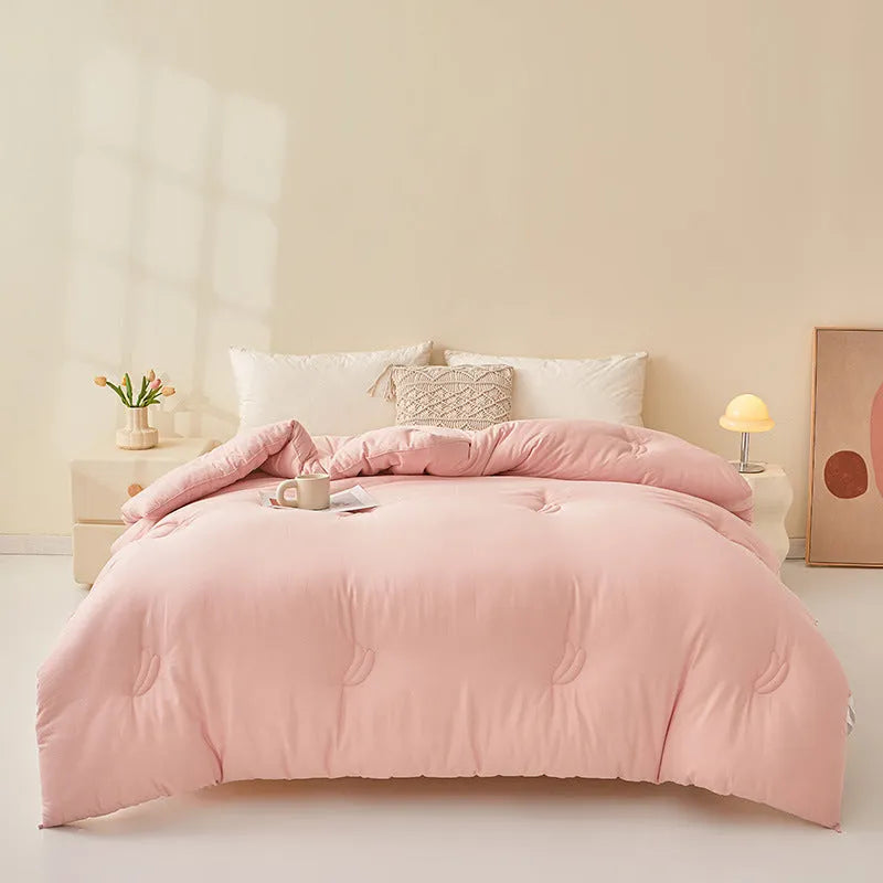Soybean fibre filled pure cotton quilt in grey, shown on a bed in a 150x200cm size.