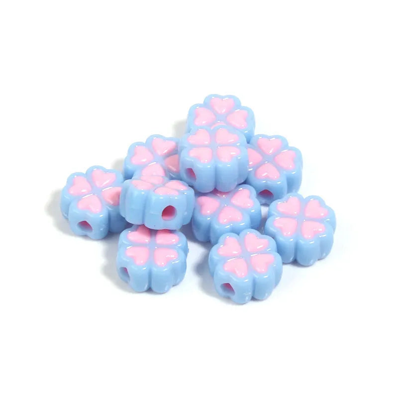 Mixed colour frosted acrylic four-leaf clover shaped beads, each 15mm in size.