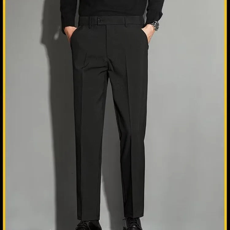 Man wearing apricot-coloured straight-leg suit trousers with an ankle-length draping effect.