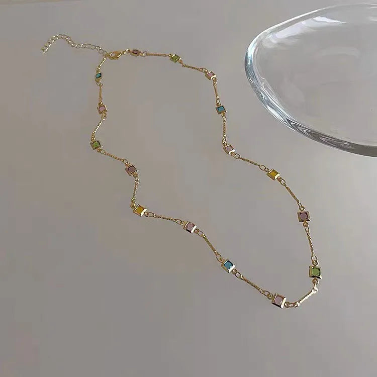 Square geometric clavicle chain necklace with crystal accents in gold plating