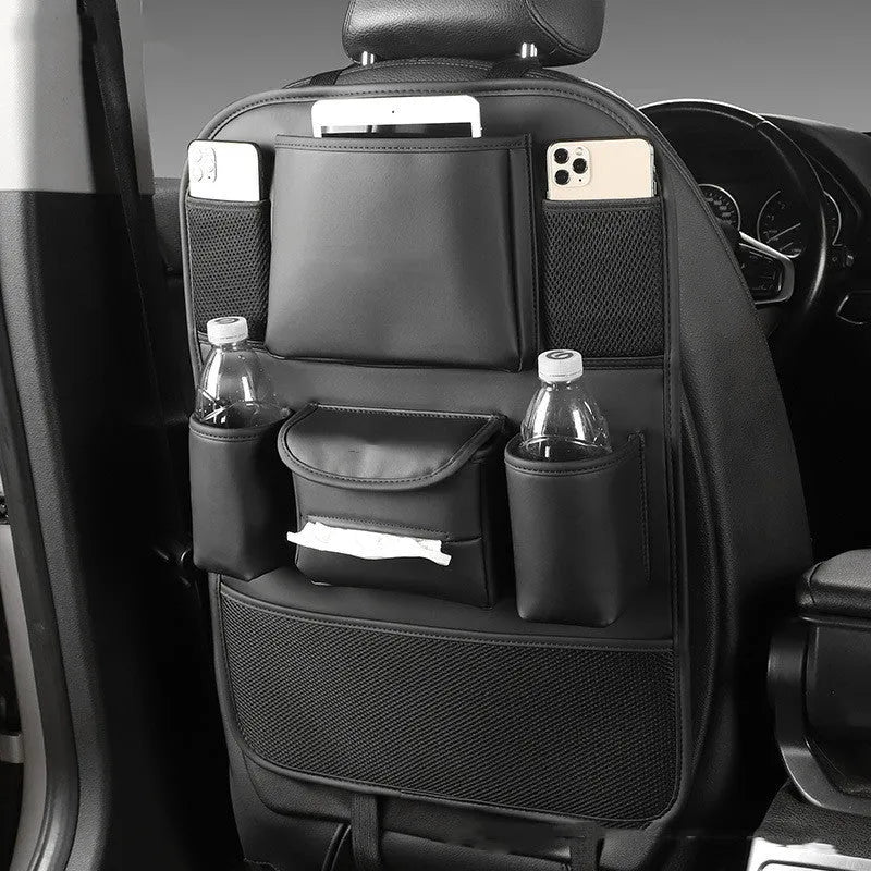 Black leather car seat back storage bag hanging on a vehicle seat.