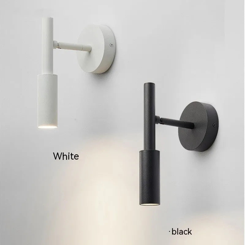 Modern wrought iron wall lamp in black with three colour light options for bedroom or living room