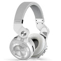 Wireless over-ear Bluetooth headset with card plug-in, shown in available colours: white, red, blue, black.