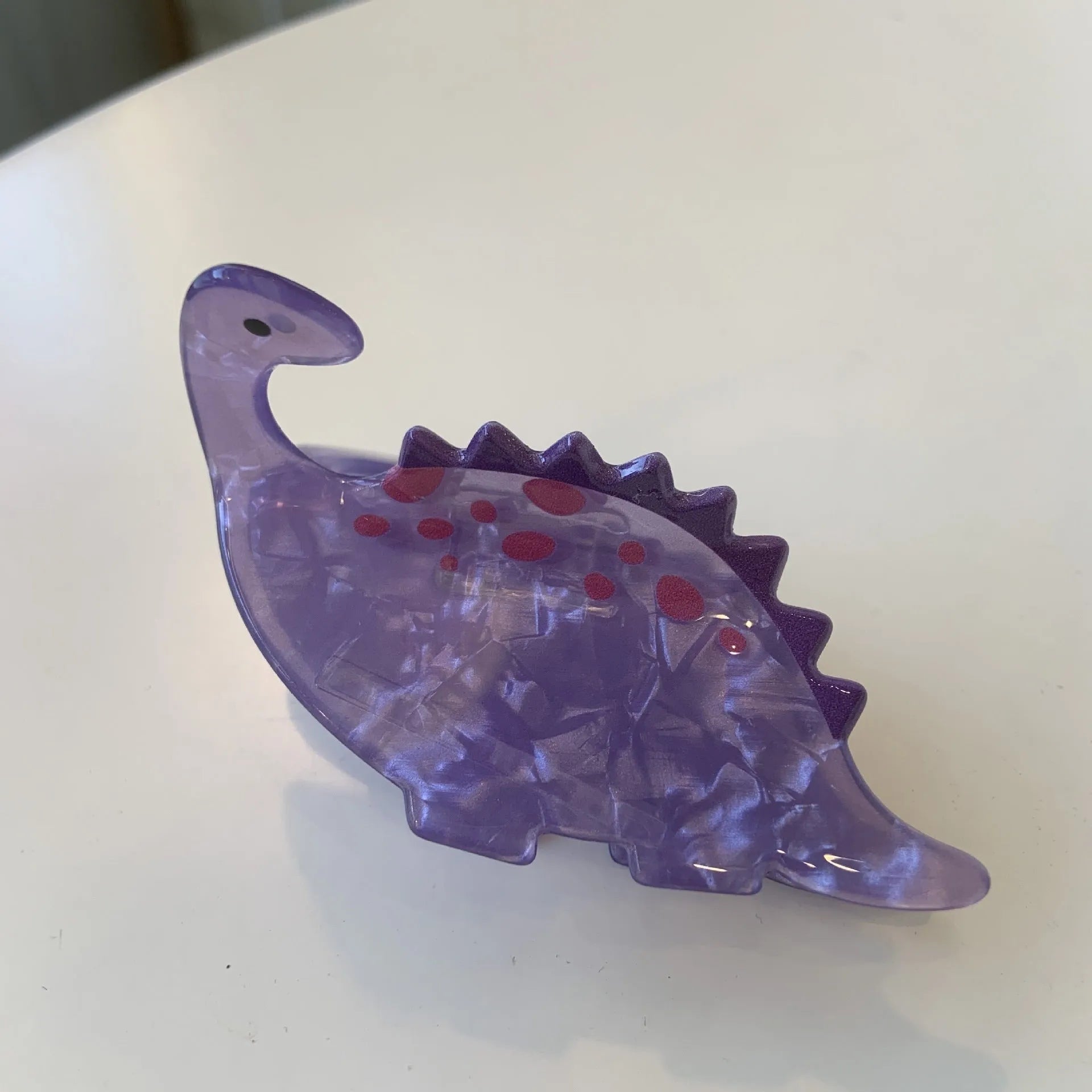 Acrylic dinosaur hair clip with jaw grip closure in one of six colourful designs