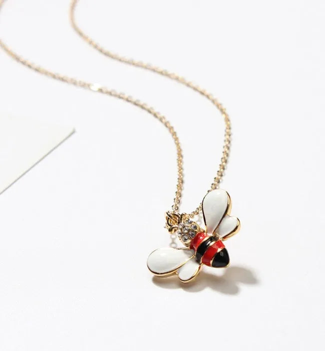 Cartoon bee drop pendant necklace on alloy cross chain for women, available in coffee, yellow, red colours
