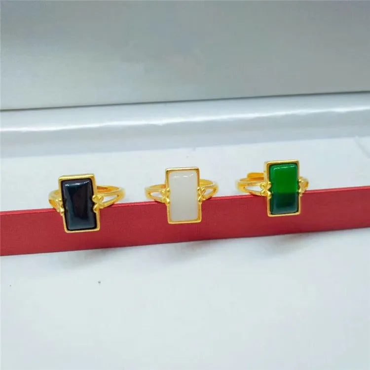 Adjustable brass gold-plated ring with gemstone inlays in black, green, or white colour options