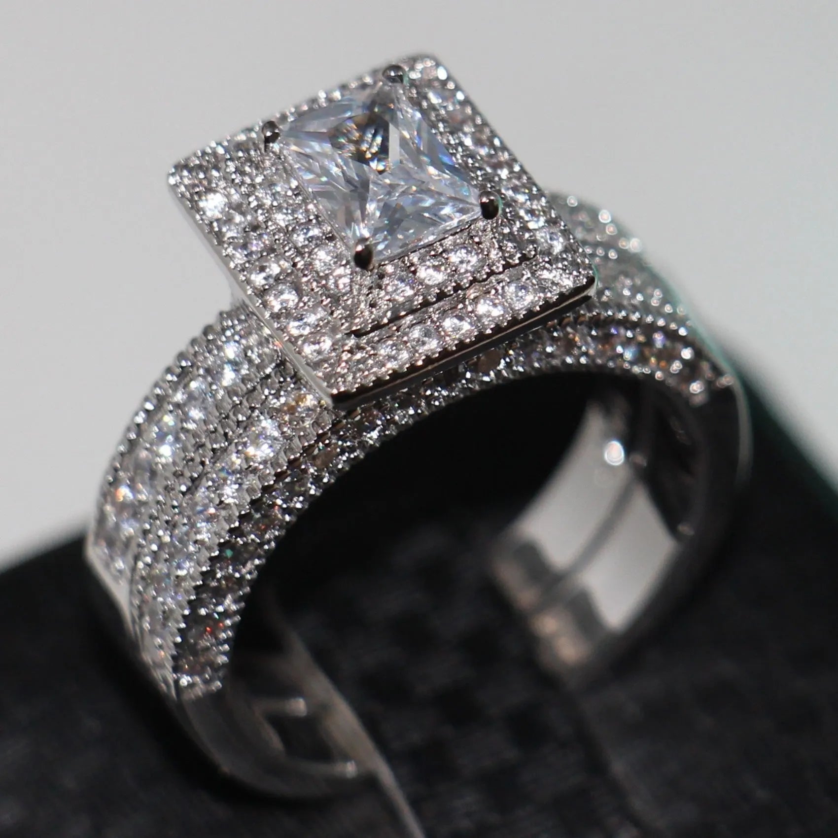 Silver zinc alloy double layer zircon ring on finger showing stacked design