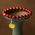 Handmade wave-shaped cinnabar and copper bead bracelet in national style.