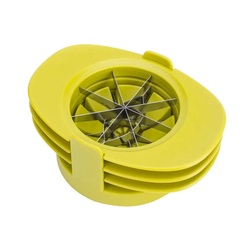 Green kitchen fruit slicer set with apple, tomato, and mango cutters on a stable base