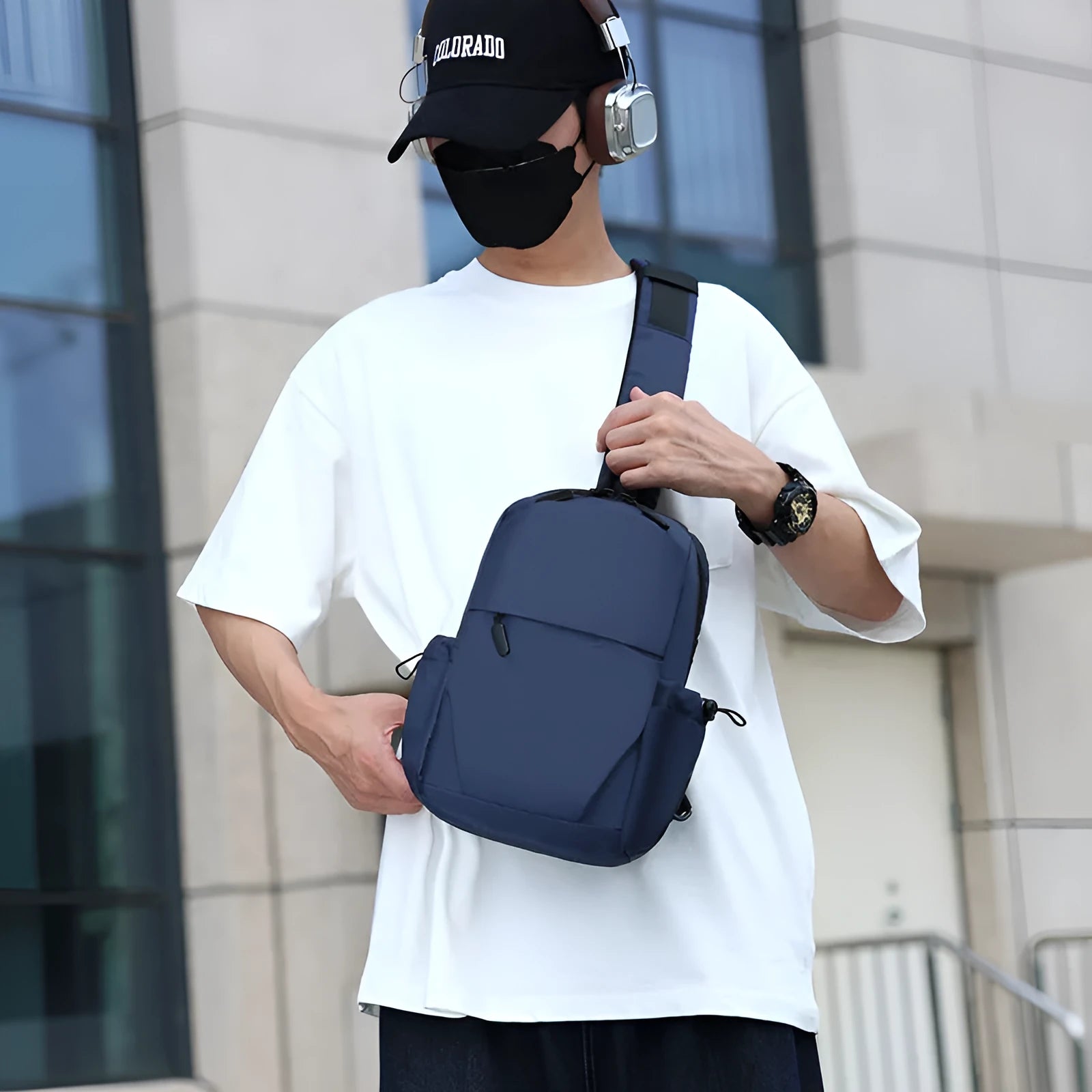 Men's grey waterproof chest bag with adjustable shoulder strap showing front compartment