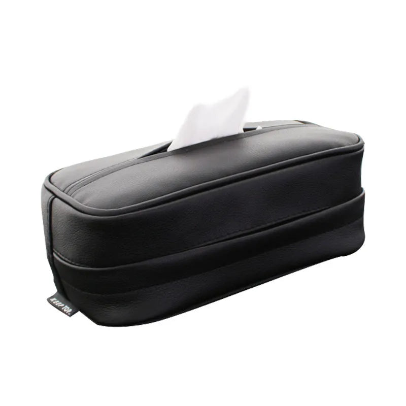 Black PU leather hanging storage box with paper bag liner, shown suspended.