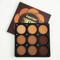Open 9-colour dark matte eyeshadow palette with repair disk, for punk and fashion makeup styles.