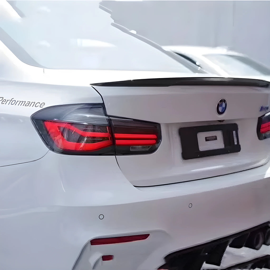 Modified LED tail light assembly for BMW 3 Series (2012-2015) in red or smoked black finish.